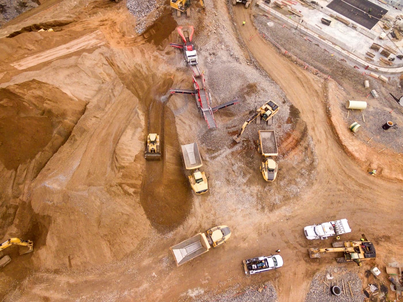 Aerial view of earthworks plant cutting a haul road